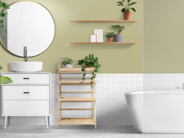 A bathroom with a white tub, green walls, and a plant; perfect for adding a touch of freestanding 1800 x 1200 bathtub to furnish your bathroom decor.